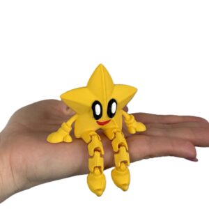 Uśmiechnięta Gwiazdka 3D – dekoracyjna figurka, siedząca gwiazdka z ruchomymi nóżkami