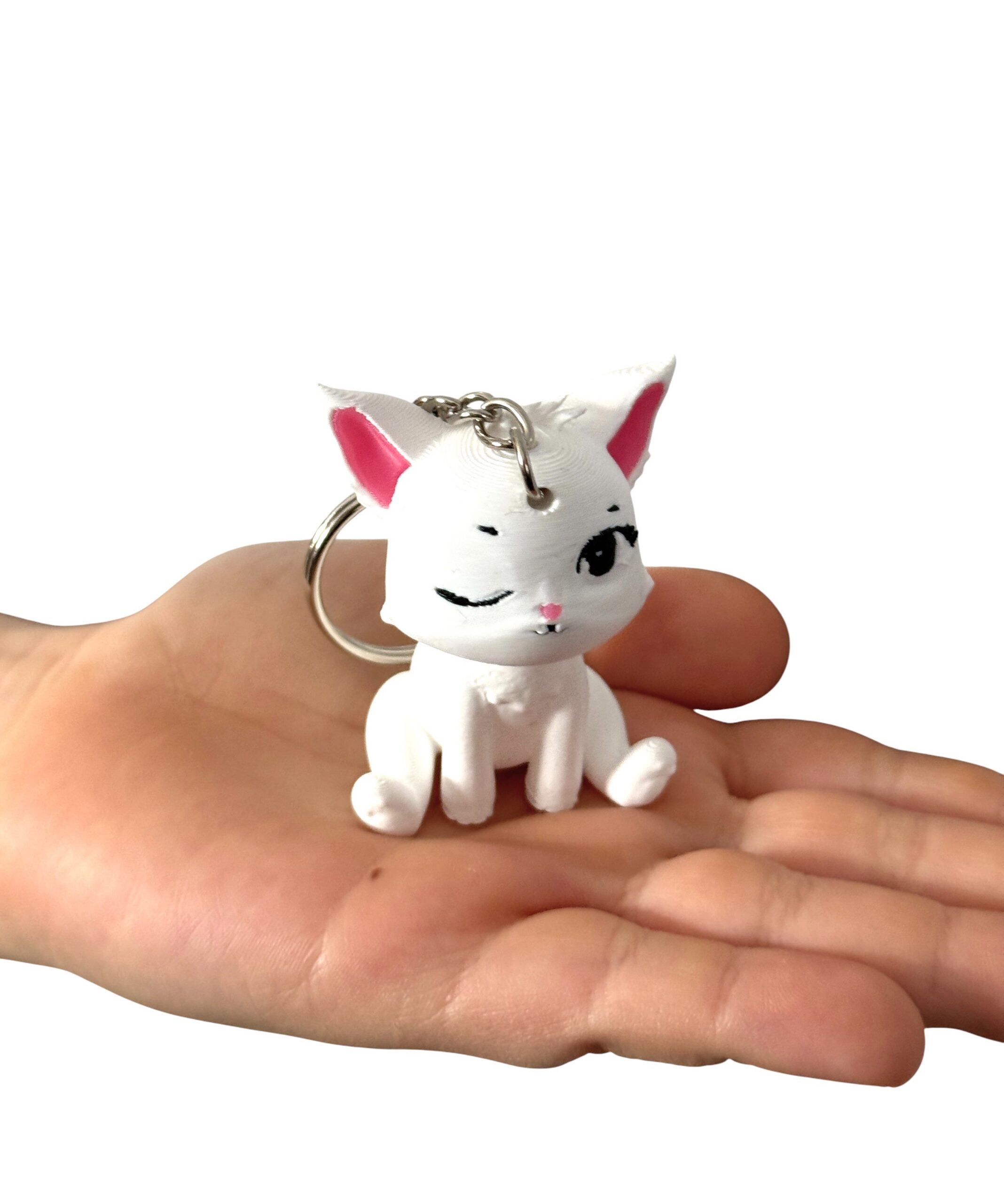 Siedzący kotek puszczający oczko 3D– brelok, mini figurka, zabawka, prezent